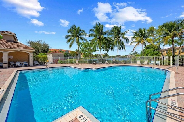 view of swimming pool with a patio