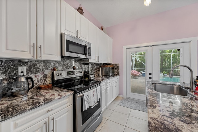 kitchen with white cabinetry, appliances with stainless steel finishes, and sink