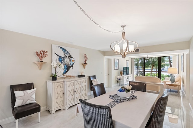 dining area with a notable chandelier