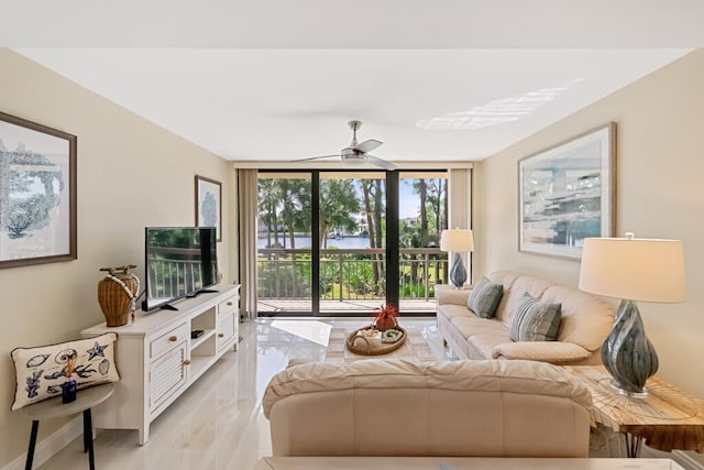 living room with light tile patterned flooring, floor to ceiling windows, and ceiling fan