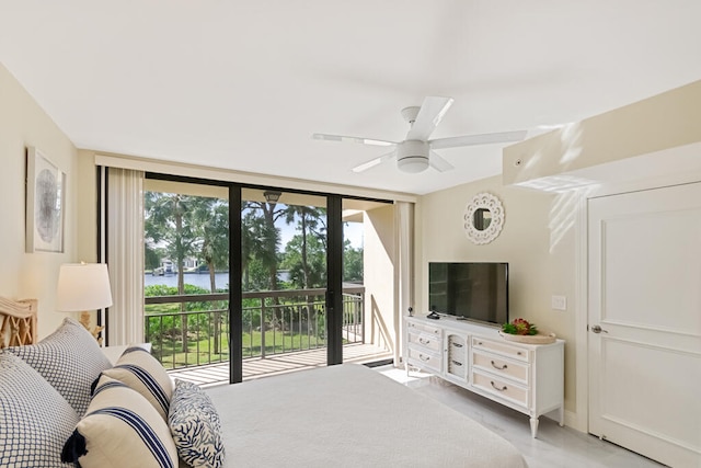 bedroom featuring access to outside, multiple windows, a wall of windows, and ceiling fan