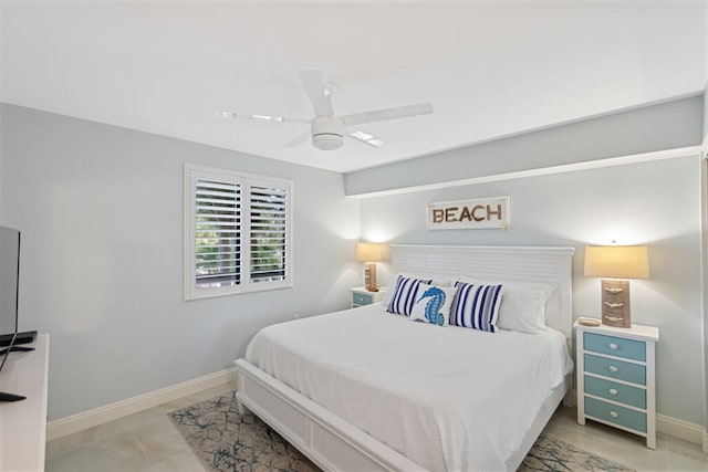 tiled bedroom featuring ceiling fan