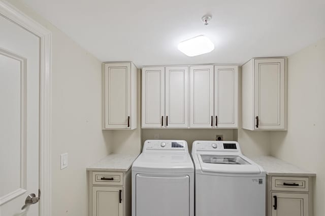 laundry area featuring cabinets and washer and dryer