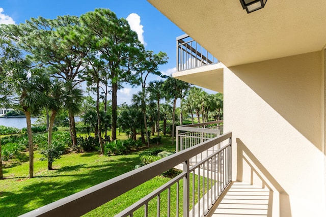 balcony featuring a water view