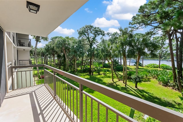 balcony featuring a water view