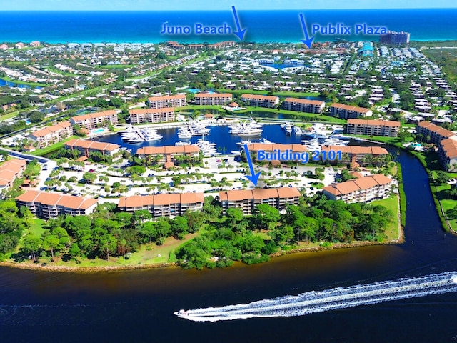 birds eye view of property with a water view