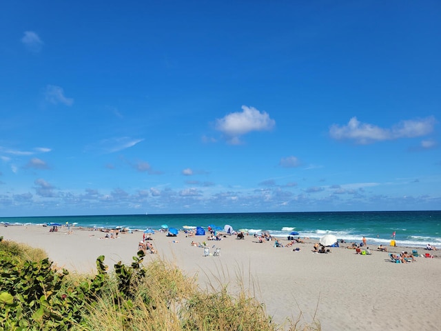 property view of water featuring a beach view