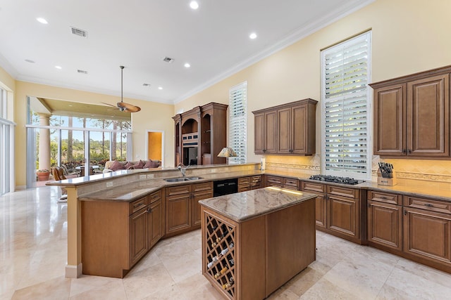 kitchen featuring plenty of natural light, a center island, and kitchen peninsula