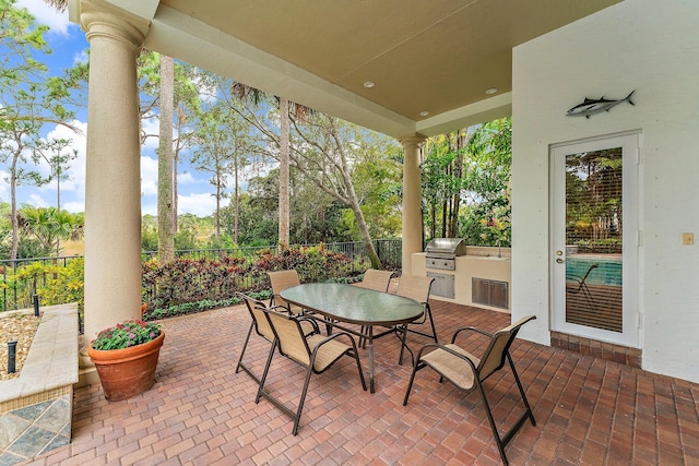 view of patio featuring a grill and exterior kitchen