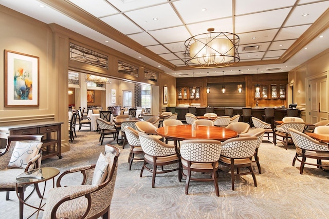 dining space with light colored carpet, crown molding, and an inviting chandelier