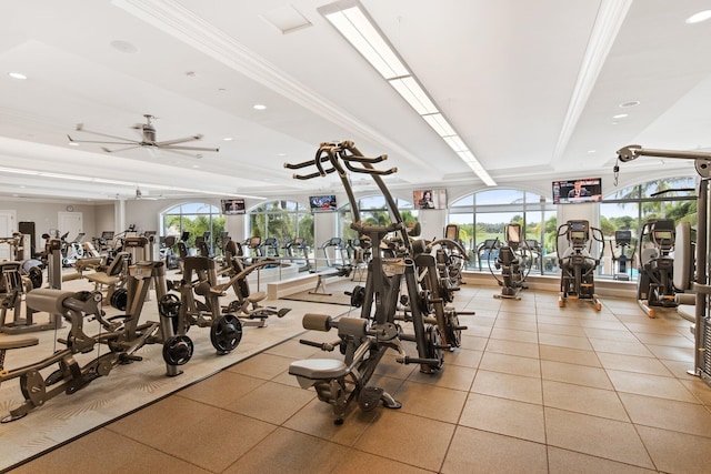 gym with ceiling fan and crown molding