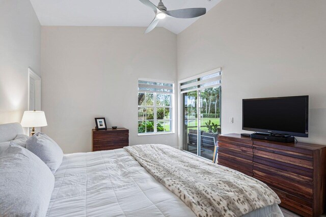 bedroom with access to outside, high vaulted ceiling, and ceiling fan