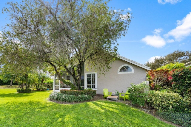 view of yard featuring a sunroom