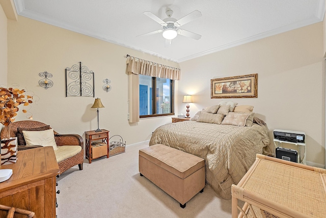 bedroom featuring ceiling fan, crown molding, and light carpet