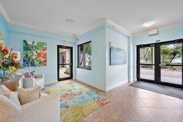 entrance foyer featuring light tile patterned flooring, ornamental molding, and french doors