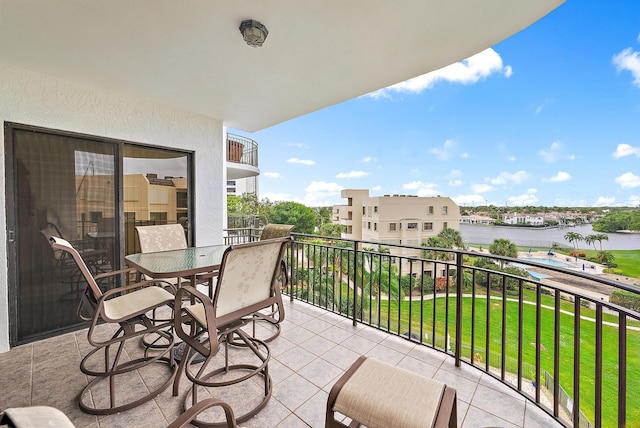 balcony featuring a water view