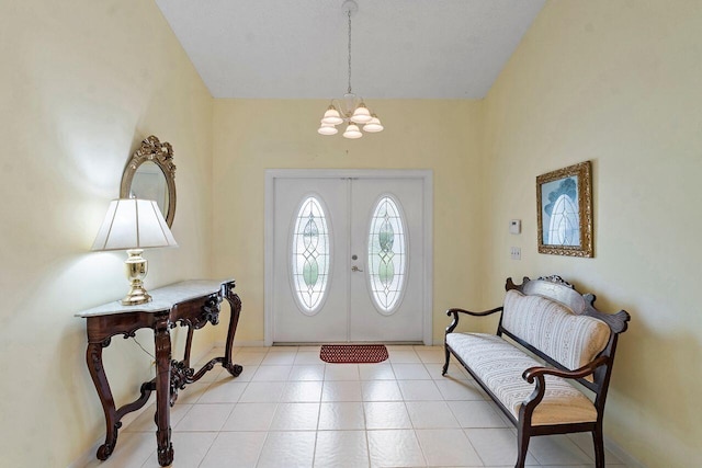 foyer entrance featuring an inviting chandelier