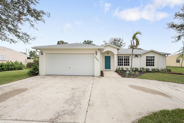 ranch-style house with a garage and a front yard