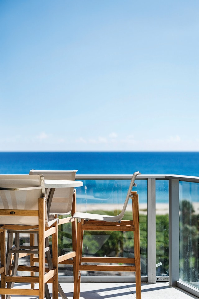 balcony featuring a water view