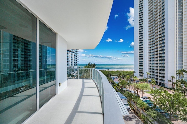 balcony featuring a water view