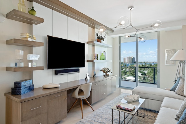 living room featuring an inviting chandelier and built in desk