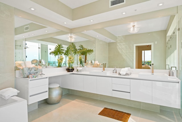 bathroom featuring tile patterned flooring and vanity