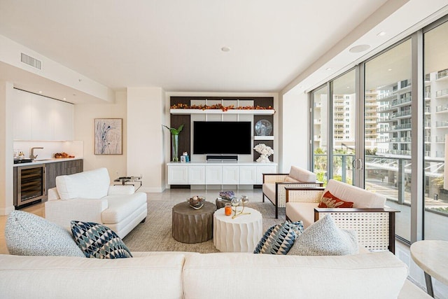 living room featuring sink and wine cooler