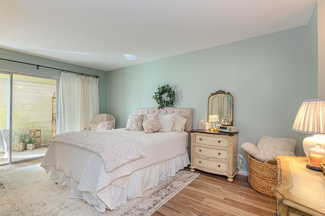 bedroom with light hardwood / wood-style floors