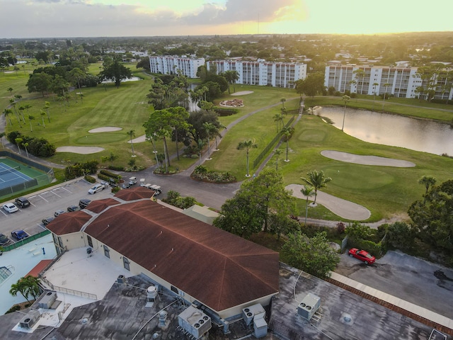 aerial view at dusk with a water view