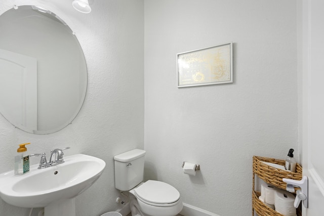 bathroom featuring sink and toilet