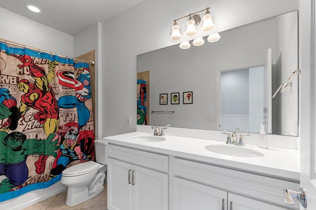 full bathroom with toilet, shower / tub combo with curtain, vanity, and tile patterned flooring