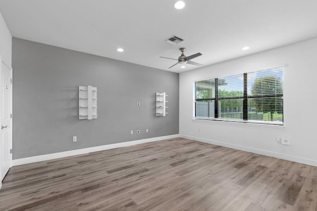 empty room featuring light hardwood / wood-style floors and ceiling fan