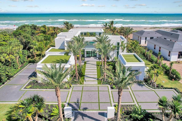 bird's eye view with a water view and a beach view