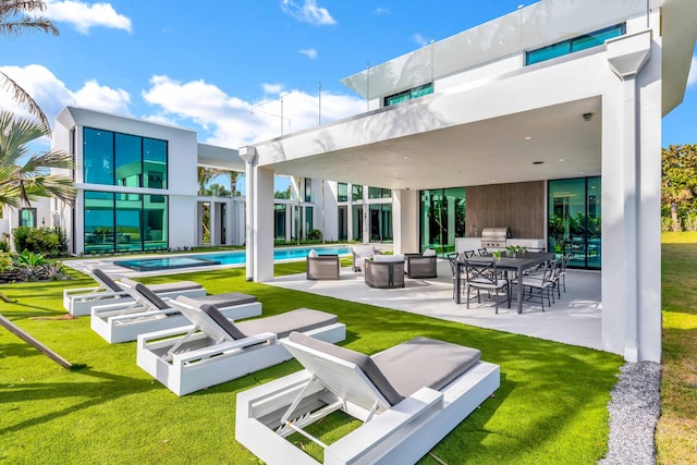 5 S Beach Rd, Jupiter Island, FL 33455 - view of property's community featuring a patio area, a lawn, a swimming pool, an outdoor living space, and outdoor dining area