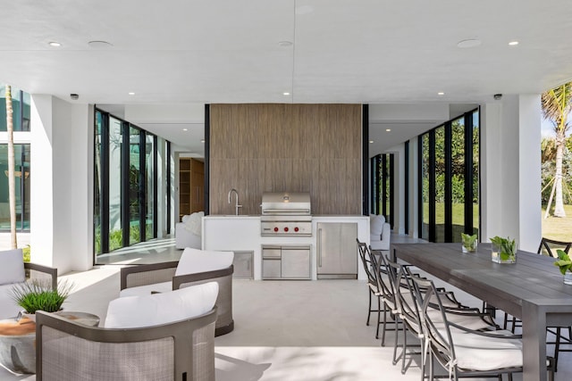 5 S Beach Rd, Jupiter Island, FL 33455 - view of patio with an outdoor kitchen and outdoor dining area