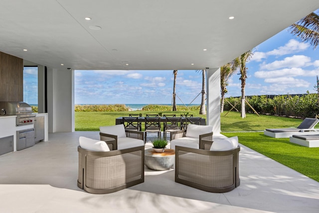 view of patio with area for grilling and an outdoor hangout area