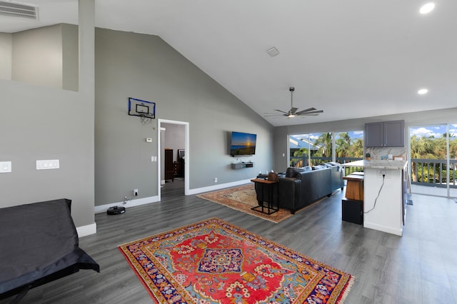 living room with high vaulted ceiling, dark wood-type flooring, and ceiling fan