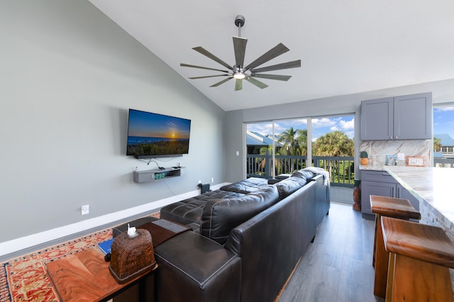 living room with high vaulted ceiling, hardwood / wood-style flooring, and ceiling fan