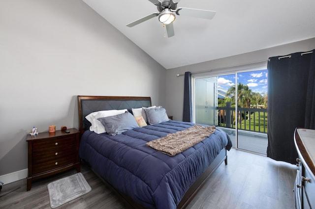 bedroom with dark hardwood / wood-style flooring, access to outside, lofted ceiling, and ceiling fan