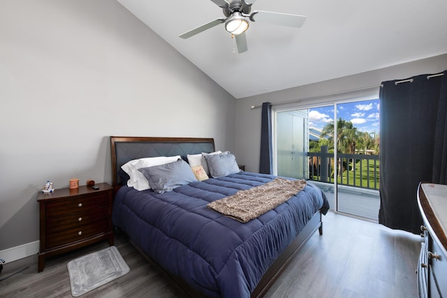 1441 NE 14th Ct Unit 4, Jensen Beach, FL 34957 - bedroom with wood finished floors, access to outside, high vaulted ceiling, and ceiling fan