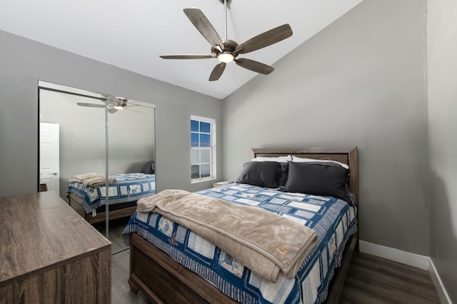 bedroom with dark wood-type flooring, ceiling fan, and lofted ceiling