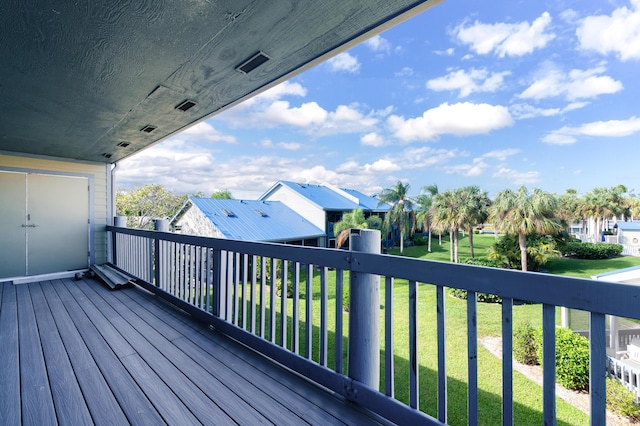 1441 NE 14th Ct Unit 4, Jensen Beach, FL 34957 - wooden deck with a lawn