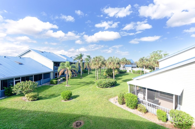 1441 NE 14th Ct Unit 4, Jensen Beach, FL 34957 - view of green lawn featuring a sunroom
