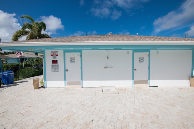 1441 NE 14th Ct Unit 4, Jensen Beach, FL 34957 - garage featuring fence