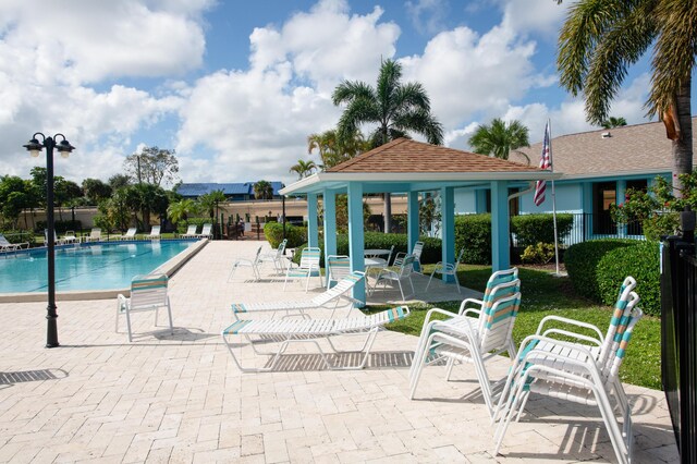 1441 NE 14th Ct Unit 4, Jensen Beach, FL 34957 - community pool featuring fence, a patio area, and a gazebo