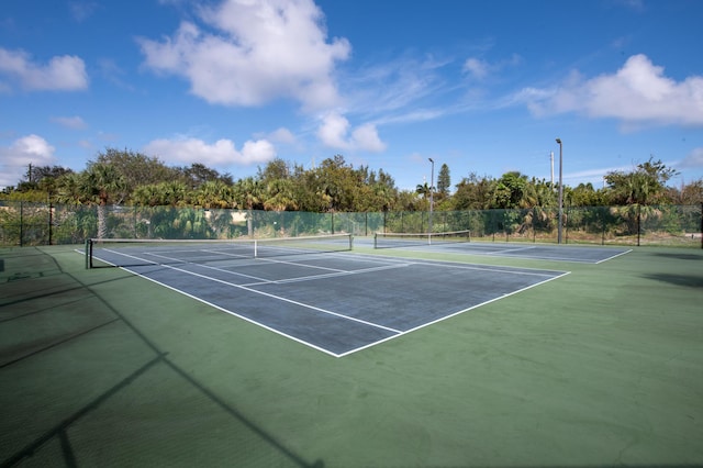 1441 NE 14th Ct Unit 4, Jensen Beach, FL 34957 - view of tennis court with fence
