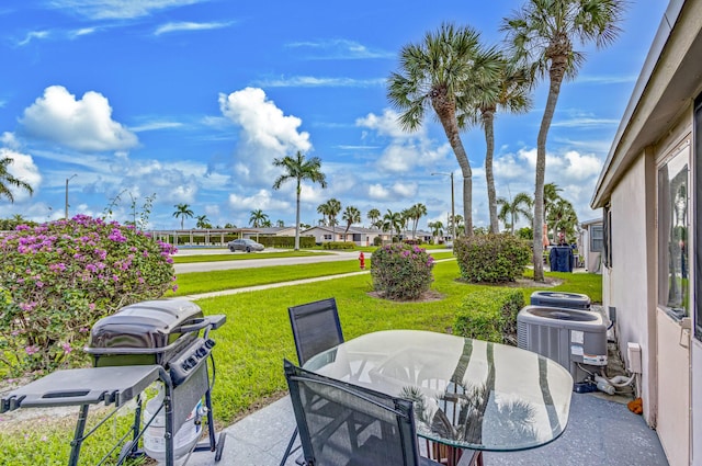 view of patio featuring central AC and grilling area