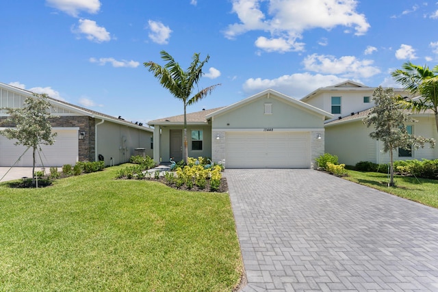 view of front facade with a front lawn and a garage