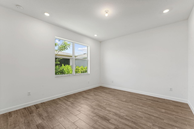 unfurnished room featuring light hardwood / wood-style floors