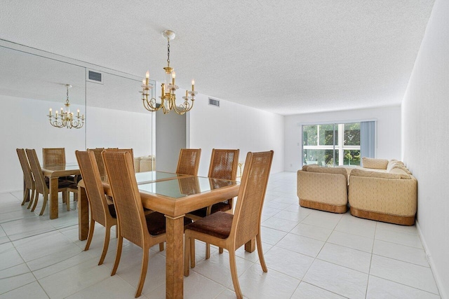 dining room with a textured ceiling, light tile patterned floors, and a chandelier